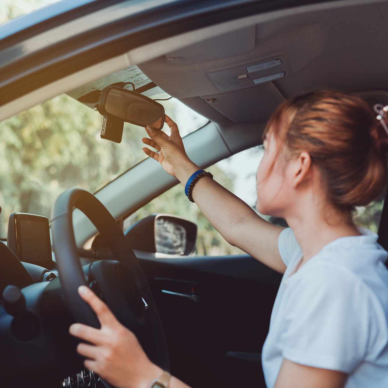 Person checking their rear view mirror.